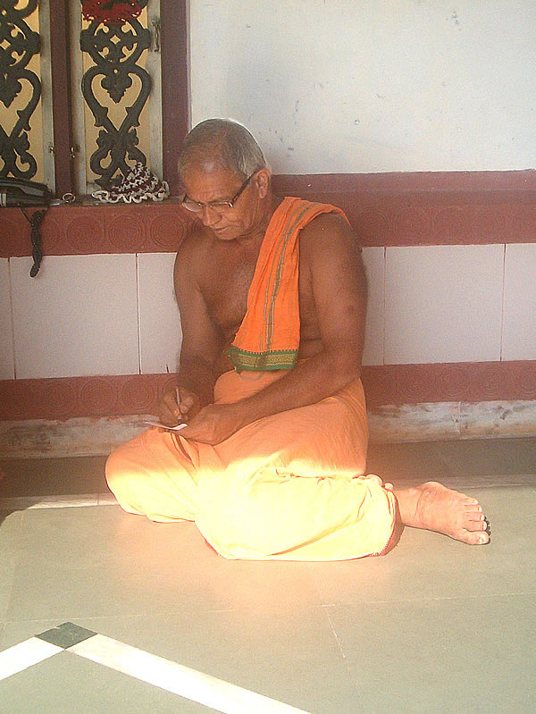 Guruji Shri Suresh J Pai penning a reply to a devotee at Shri Mahalasa Narayani Devi Kshetra, Harikhandige